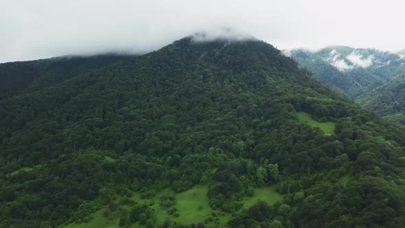 Aerial Hyperlaps of moving clouds in mountain valley. Carpathian mountains, Ukraine alt