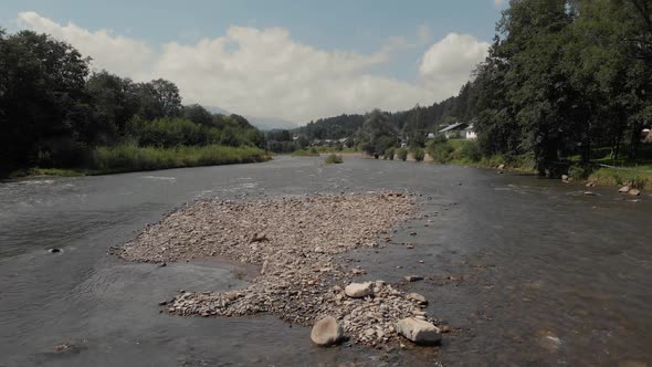 Countryside Landscape with Flowing River on Summer Day alt