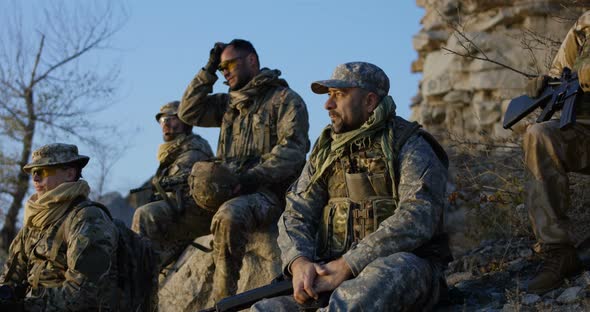 Group Soldiers Taking a Break During an Assault alt