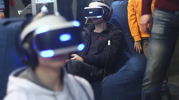 People In Virtual Reality Helmets Play alt