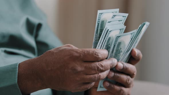 Closeup Old Male African American Hands Counting Money Dollars Indoors alt