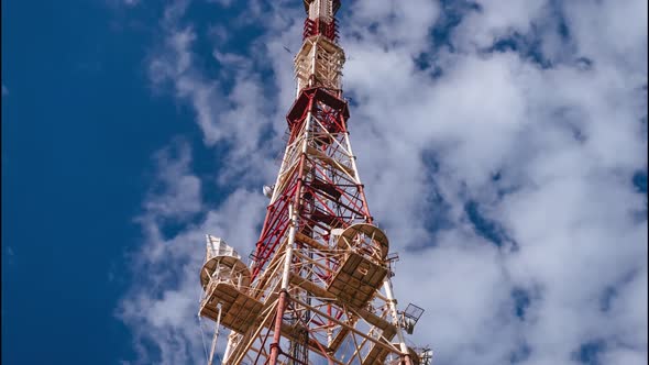 A Television Tower Against the Sky with Fastflowing Clouds