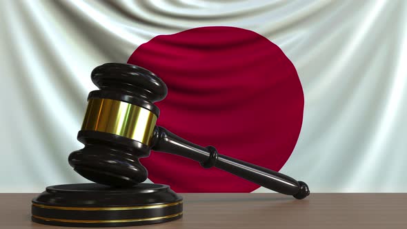 Judge's Gavel and Block Against the Flag of Japan