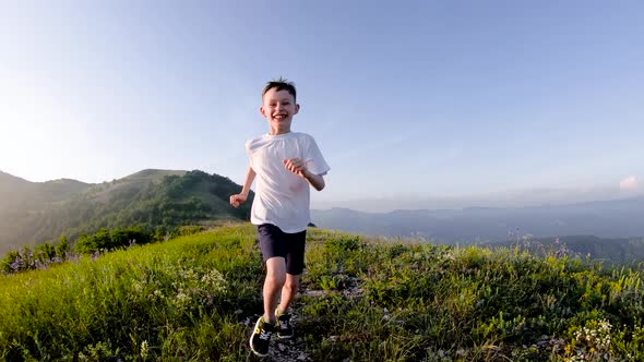 Boy Running in The Mountains.