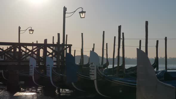 Scene of Venice Dock with Gondolas Moored Near the Pier alt