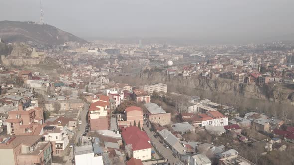 Tbilisi, Georgia - April 3 2021: Flying over Ortachala district in old Tbilisi. alt