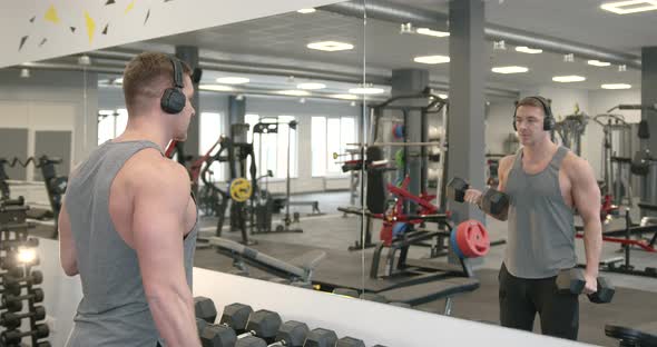 Young Athlete Performing Biceps Exercises with Dumbbells