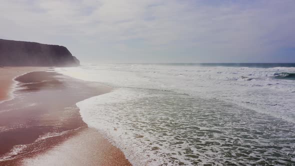 Praia Grande Beach at Sintra, Lisbon, Portugal, on the Atlantic Coast, a Beautiful Sandy Beach with alt