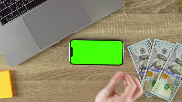 The Man is Zooming on the Phone Green Screen Mockup in Horizontal Position