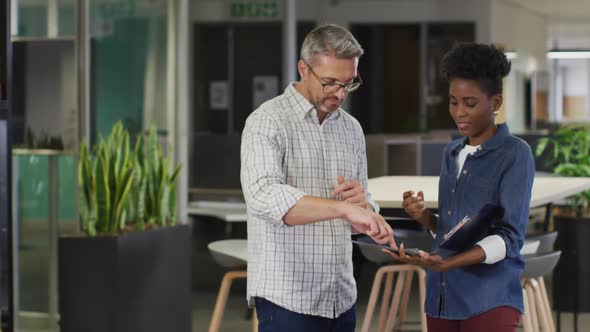 Video of diverse businessman and businesswoman talking about project alt