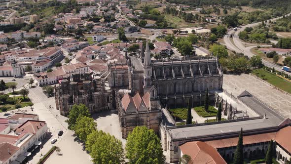 Batalha Monastery in Leiria, Portugal,  on sunny day - circling, drone shot alt