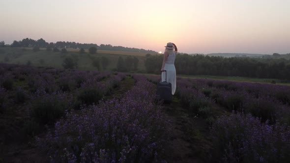 Women with a Suitcase and Lavender Field