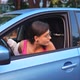 A Young Angry Woman Peeks Out of the Car Window - VideoHive Item for Sale