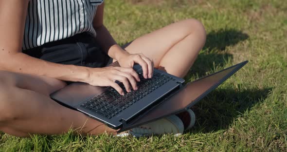 Close Up Hands of Freelance Woman Working Outdoor with Laptop Typing on Keyboard alt