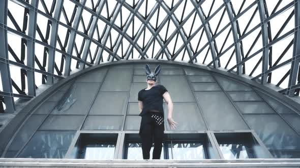 Man Dance in Mask in City alt