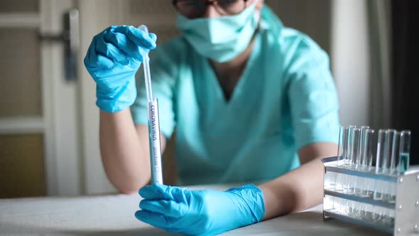 Doctor taking samples from coronavirus COVID-19 test tube