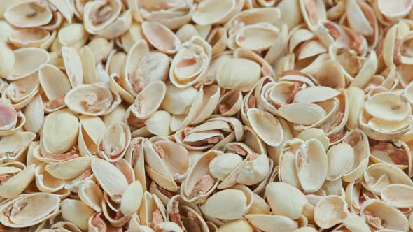 Looped Rotating Empty Pistachios Shells Full Frame Closeup Background