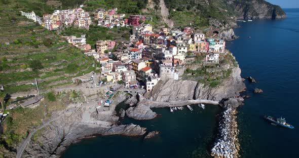 Drone view of colorful coastal hamlet of Manarola on alluring Cinque Terre alt