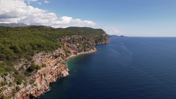Aerial view of the Pasjaca cliff and beach, blue sea and mountains, Croatia alt