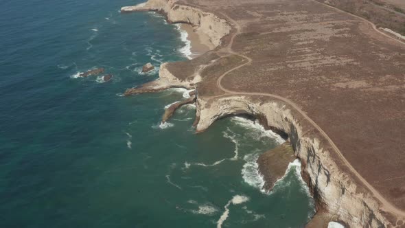 Aerial view of ocean at Shark Fin Cove on High way 1 in Northern California alt
