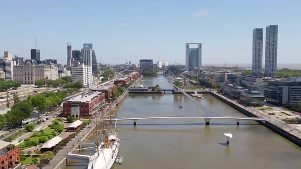 Aerial establishing shot flying over Puerto Madero docks in Buenos Aires city alt