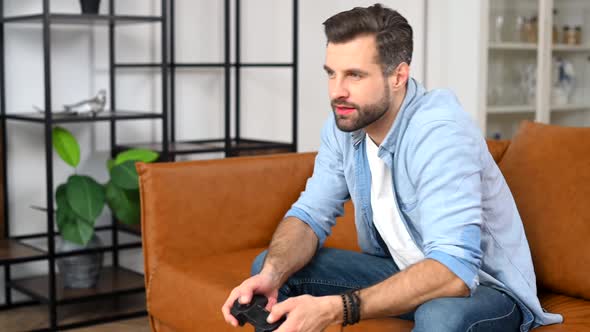 Frustrated Young Man Loses a Video Game alt