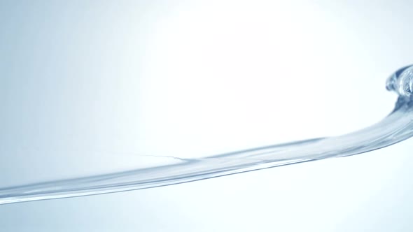 Slo-motion water moving in wave alt