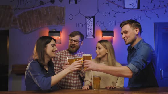 Group of Friends Celebrate with a Toast and Clink Raised Glasses with Beer