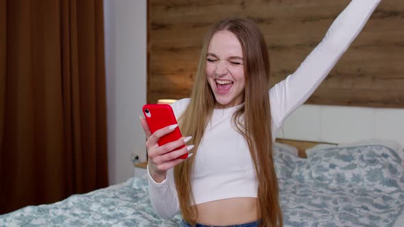 Joyful Girl Reading Good News Enjoy Success Shopping Celebrating Lottery Victory on Mobile Phone alt