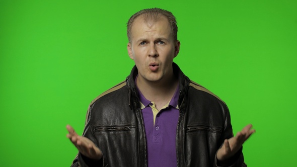 Why. Upset Rocker Man Raising Hands in Indignant Expression, Quarreling, Asking Reason of Conflict alt