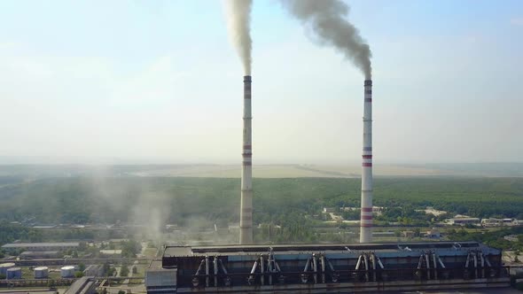 Smoking Pipes Of Thermal Power Plant. Smoke from factory chimney in an industrial plant alt