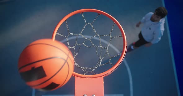 Men Play Basketball Throwing Ball Into Basket Upper View alt