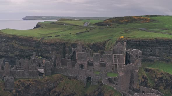 Dunluce Castle ruins on the Antrim Coast, Northern Ireland. Aerial drone view alt