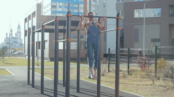 A man exercising on a sports ground