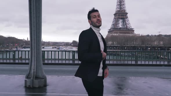 Stylish Guy Walking on a Eiffel Tower Background