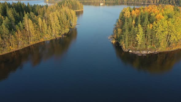 The Aerial View of the Trees on the Middle of Lake Saimaa on a Sunny Day