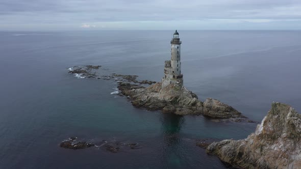 Abandoned Lighthouse Aniva on the Rock in Sakhalin Island, Russia. Aerial View.