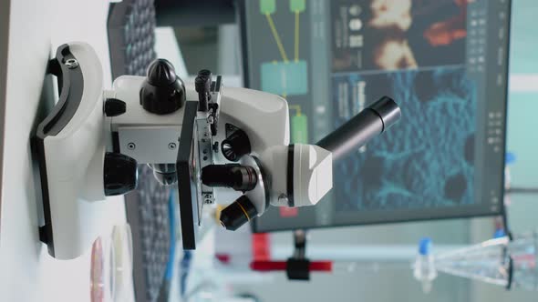 Vertical Video Scientific Microscope on Laboratory Desk with Researching Instruments alt