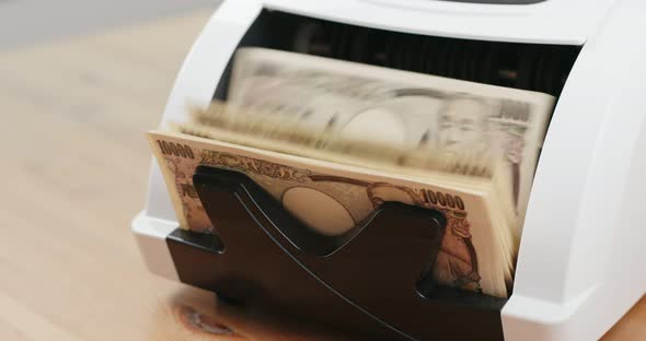 banknote on Money counting machine alt