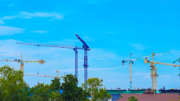 4k Time-lapse of Industrial construction crane with blue sky background