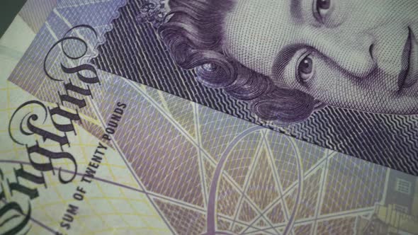 Fifty British Pound paper banknote in close up macro view dolly shot. alt