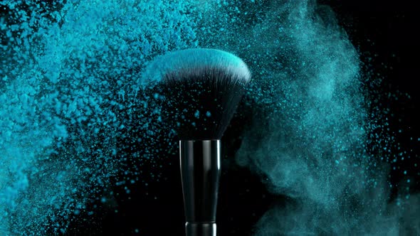 Super Slow Motion Shot of Makeup Brush and Blue Powder Shake at 1000 Fps alt