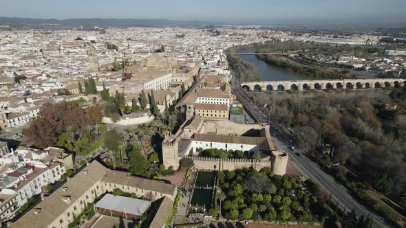 Backwards drone riser reveals historic city of Cordoba, Spain, Europe
