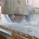 Large Industrial Stone Cutter Cuts Granite Rock Into Plates in Jets of Water Close Up - VideoHive Item for Sale