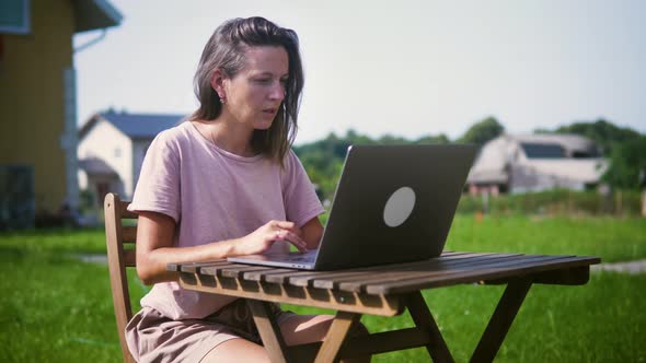Woman Working Remote At Countryside Cottage