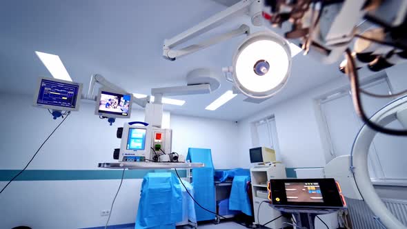 Contemporary equipment inside empty surgery room.  alt