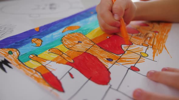 Little Kid Hands Make a Funny Drawings on Paper Hands Close Up alt