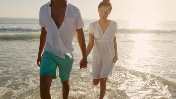 Young couple by the sea alt