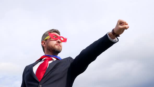 Leader Aspirations and Male Courage of Successful Man in Hero Mask on Sky Background Superhero