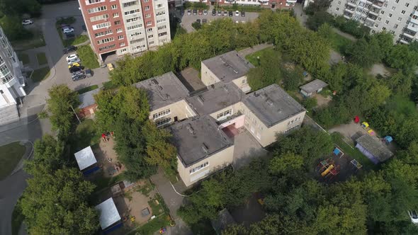 Aerial view of empty preschool building in city 10 alt